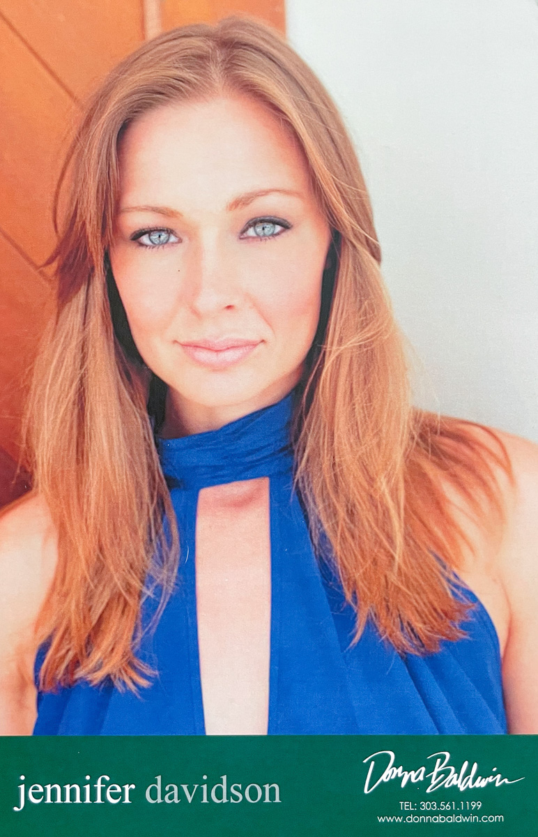 Model Renae Vespremi on the front of a Donna Baldwin Agency comp card, a headshot in a blue halter top, printed with the name Jennifer Davidson