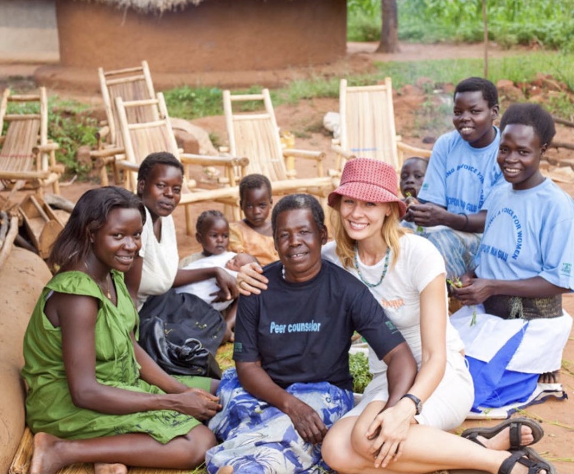 Photojournalist Renae Vespremi with women and children of WGEF's program in Gulu, Uganda